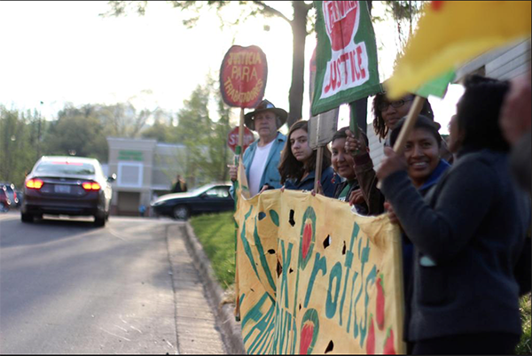 Asheville residents holding a protest at the early-morning Publix opening in their town last week
