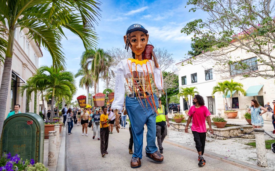 Esperanza, the CIW's 15 ft-tall, mobile puppet in the form of a female farmworker, walks the luxury store-lined streets of downtown Palm Beach on Day One of the Farmworker Freedom Festival yesterday, spreading her message of hope for a Fair Food agreement and a future of collaboration between workers and hamburger giant Wendy's toward a more modern, more humane produce industry.