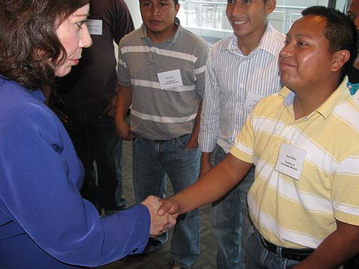 Secretary of State Hilda Solis congratulates CIW at the 2009 signing ceremony with Compass Group