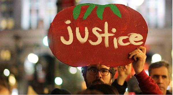Fair Food allies march with farmworkers in New York to the office of Wendy's Board Chairman, Nelson Peltz