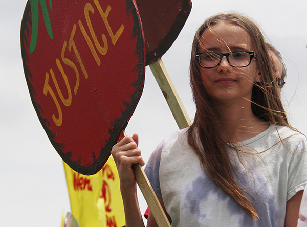 Cornerstone UMC Member and Girl Scout Annabelle Chapman, who never misses a Southwest Florida protest, rain or shine.