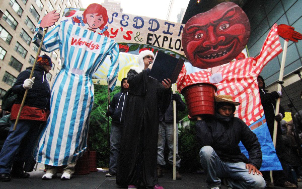 CIW's theater piece, complete with 9-ft puppets, concluded with a call to boycott the world's third largest hamburger chain.